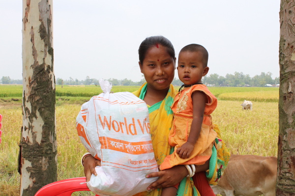 Mother and baby with bag of coronavirus supplies