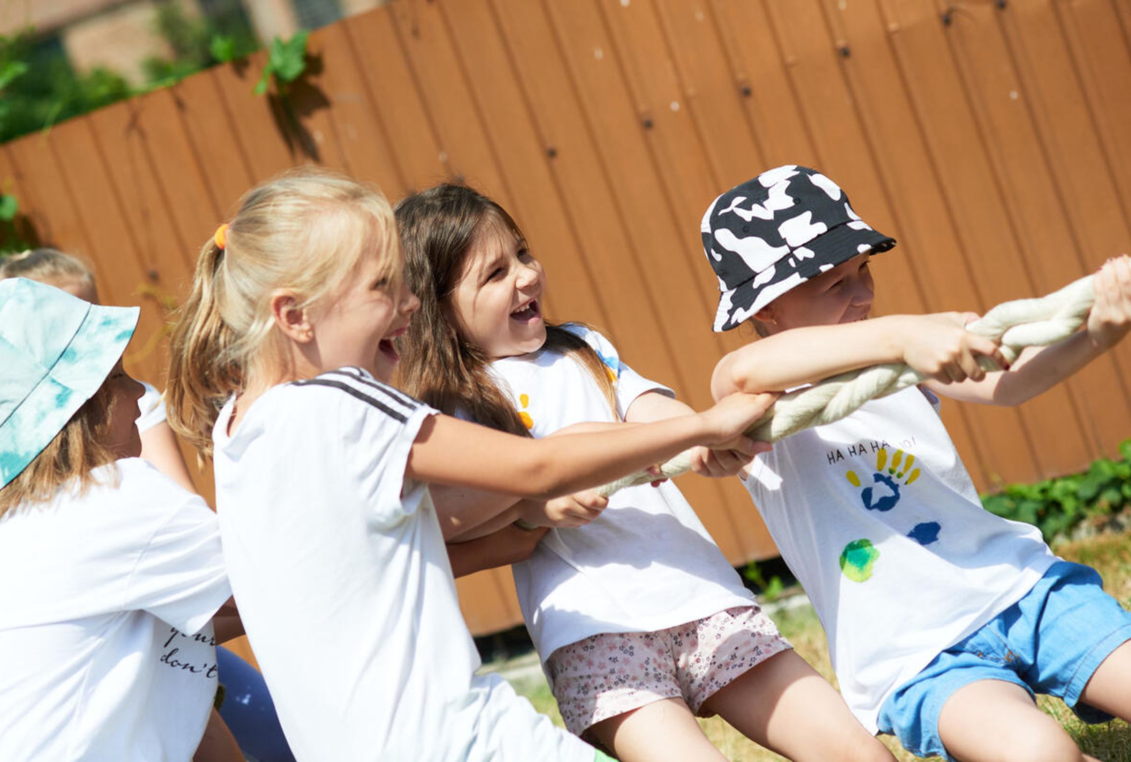 Ukrainian children tugging on a strong piece of rope