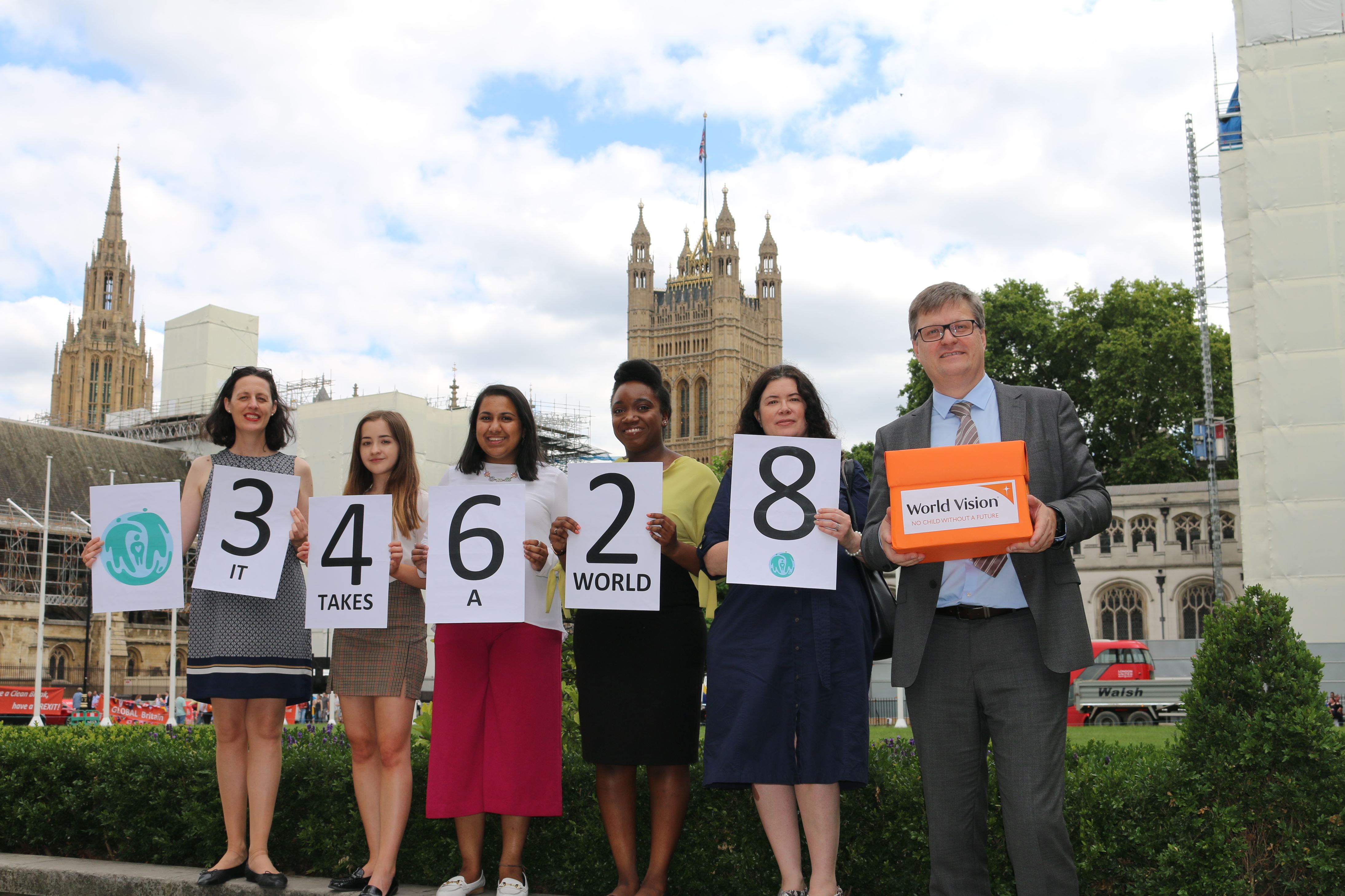 World Vision Youth Advocates and staff hand in an ending violence against children petition in Westminster