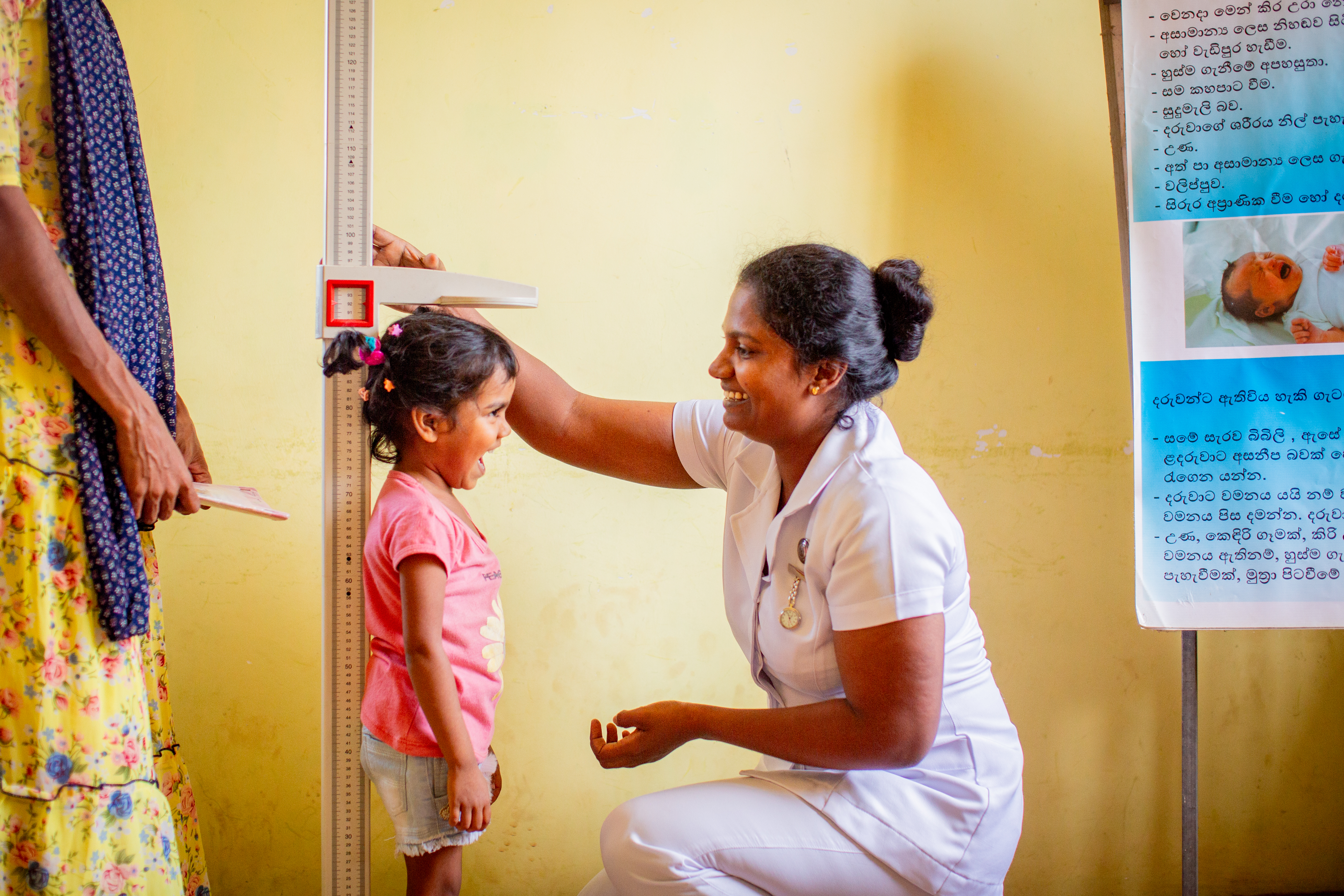 Aniga in Sri Lanka getting checked by local nurse