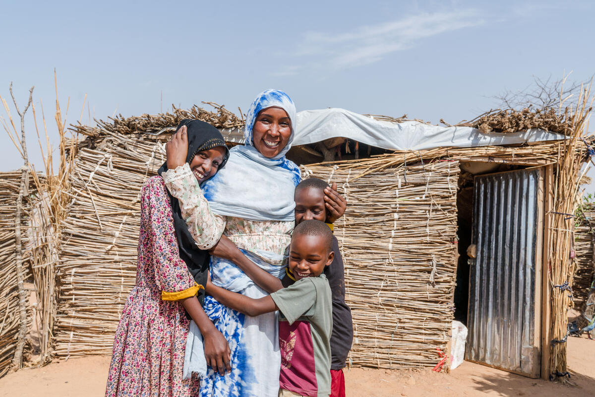 A mother and her smiling children in Chad.