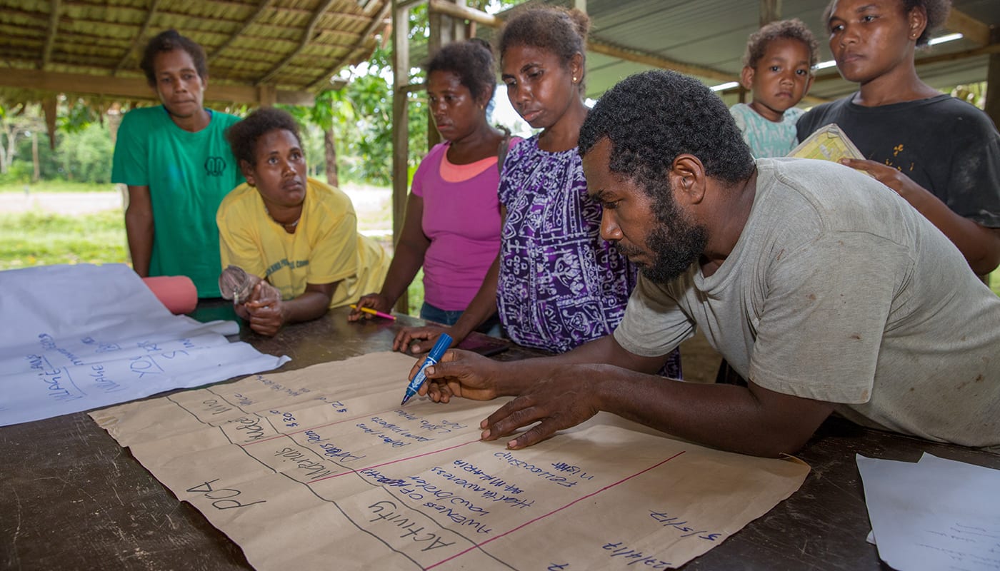Members of a Pacific Island community plan together