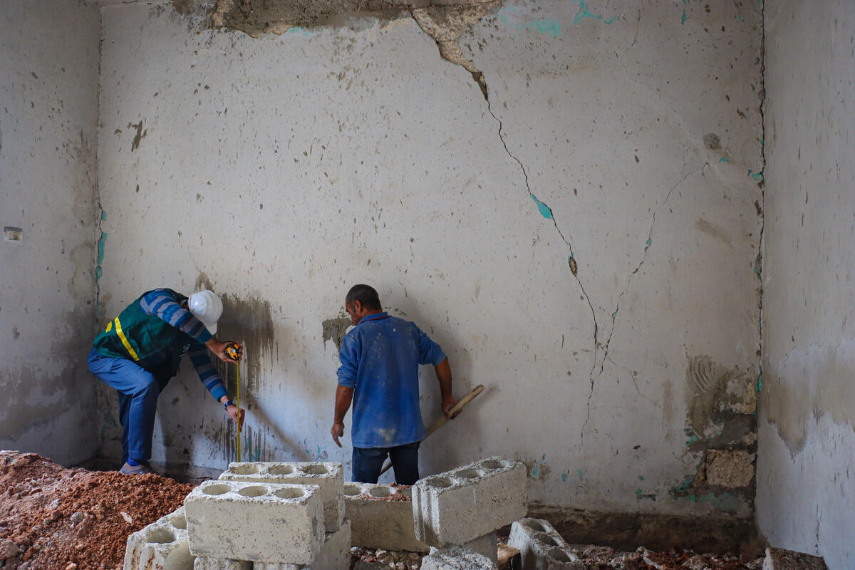 Two men rebuilding infrastructure after earthquake in Syria