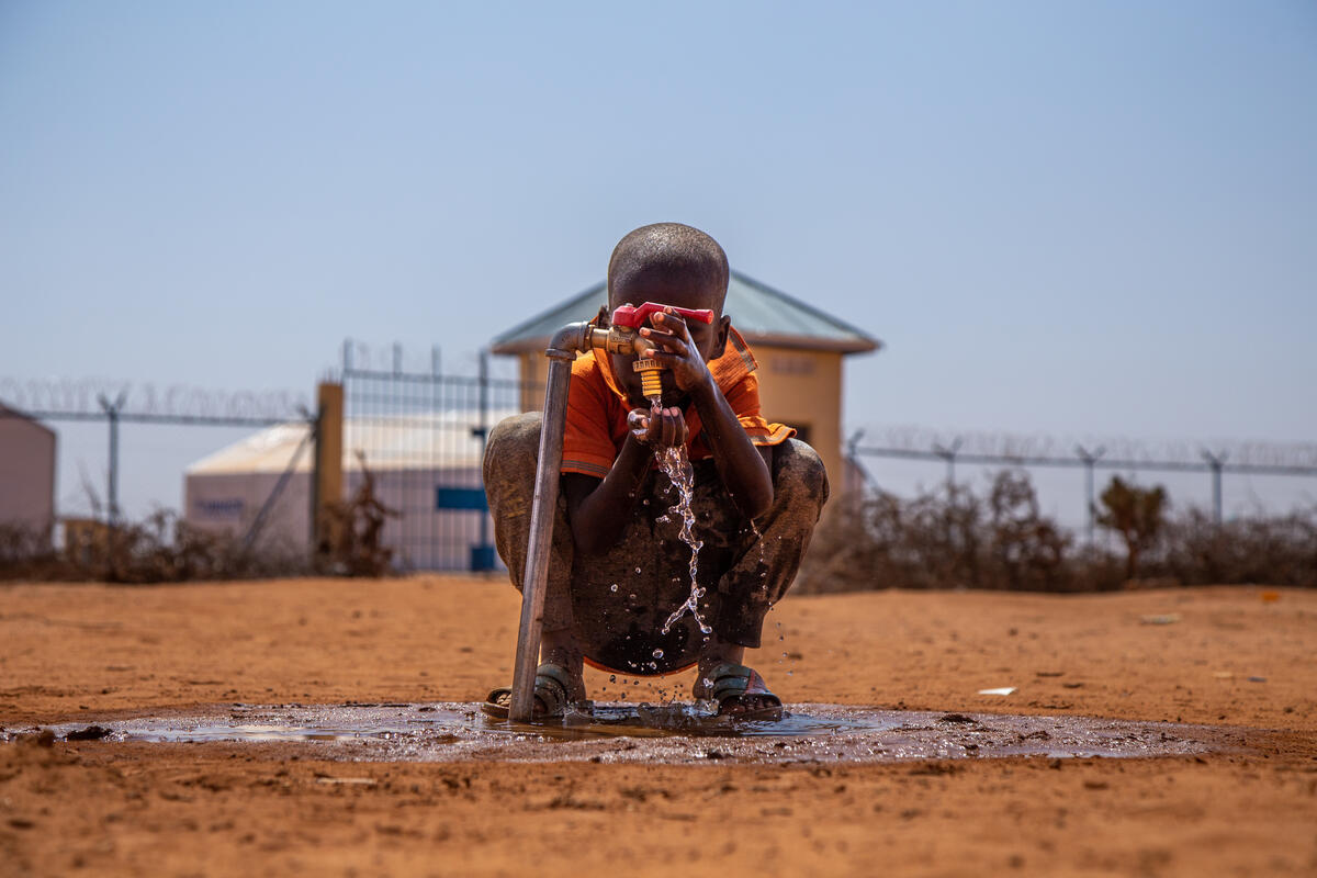 Child using water pump