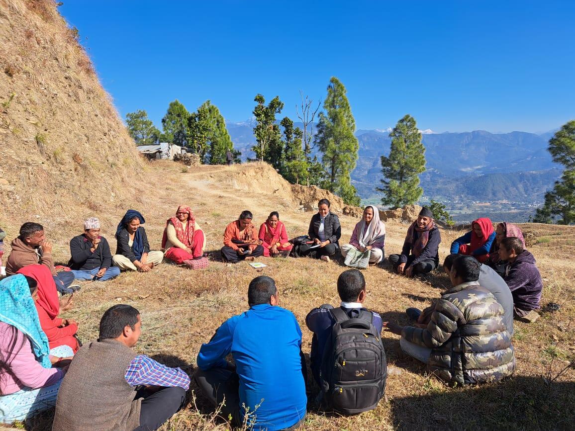 Group of people sitting in a circle in Nepal